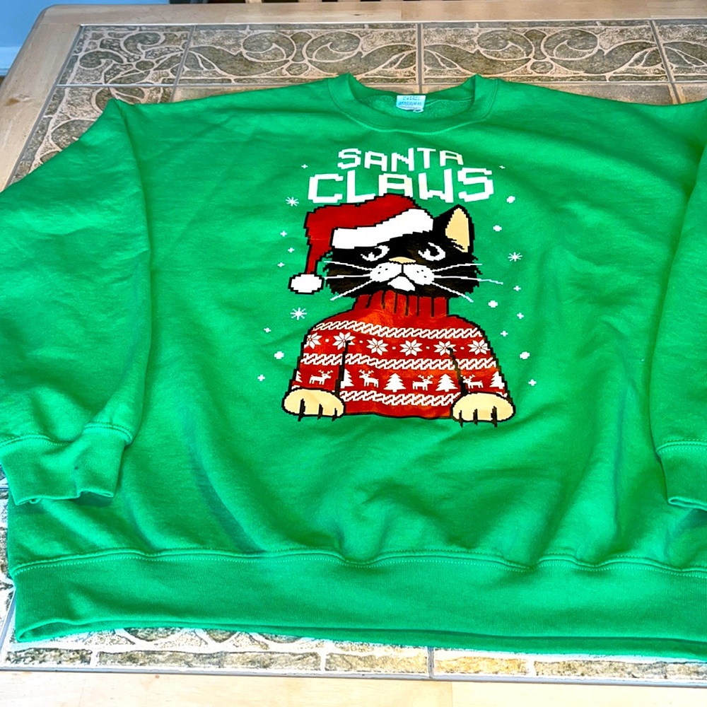 Gildan Christmas sweatshirt with Santa Claws print on front. Size XL.